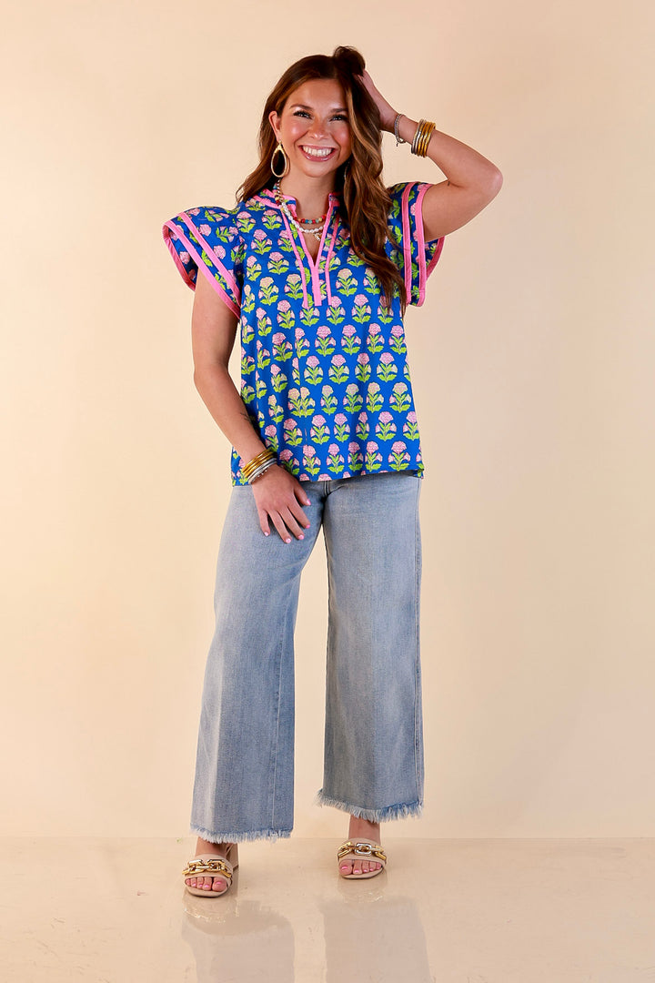 Fresh Perspective V Neck Floral Print Top with Ruffle Cap Flutter Sleeves and Contrast Trim in Royal Blue