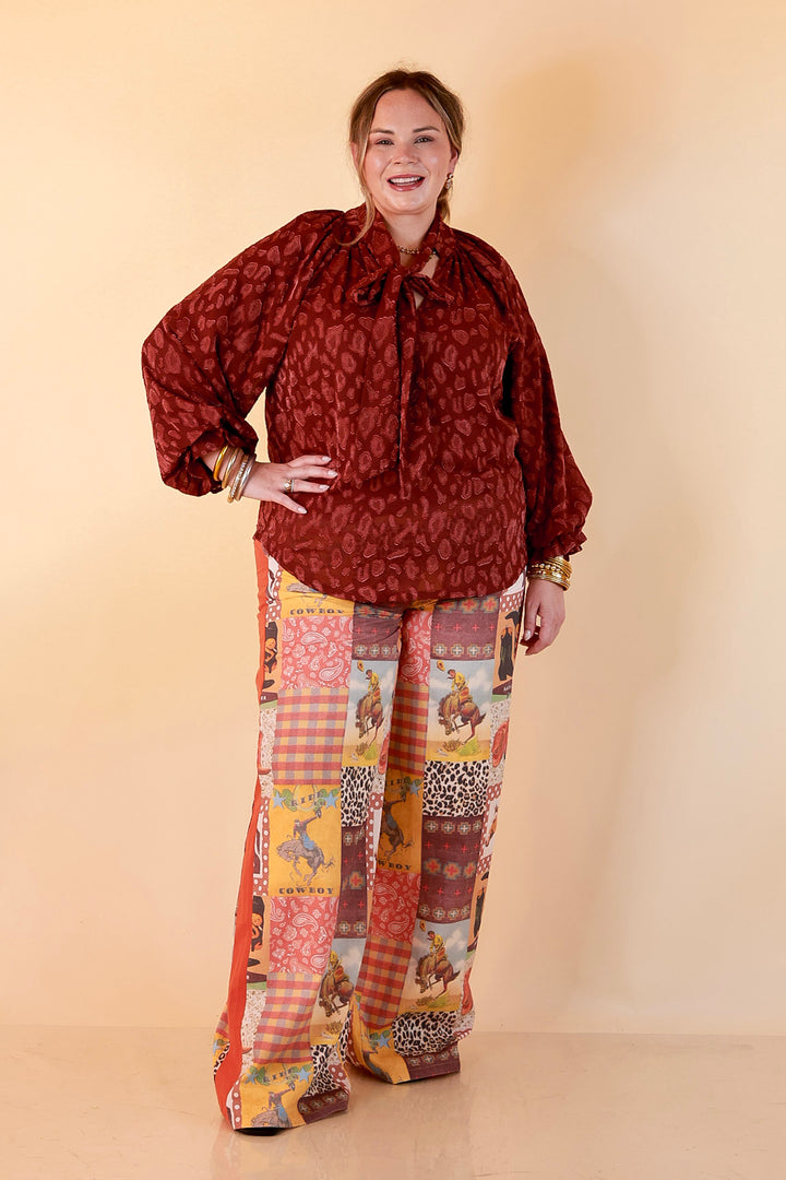 Commanding Attention Tie Neck Velvet Animal Print Balloon Sleeve Blouse in Burgundy