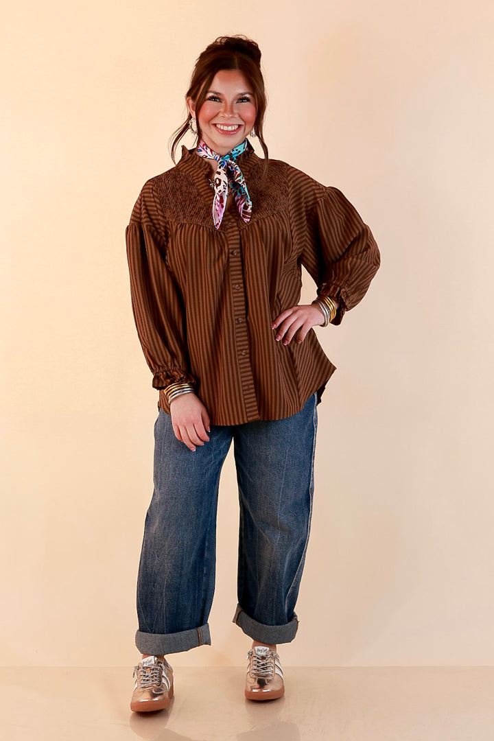A Fine Line Smocked Ruffle Neck Long Sleeve Striped Button Front Blouse in Chocolate Brown