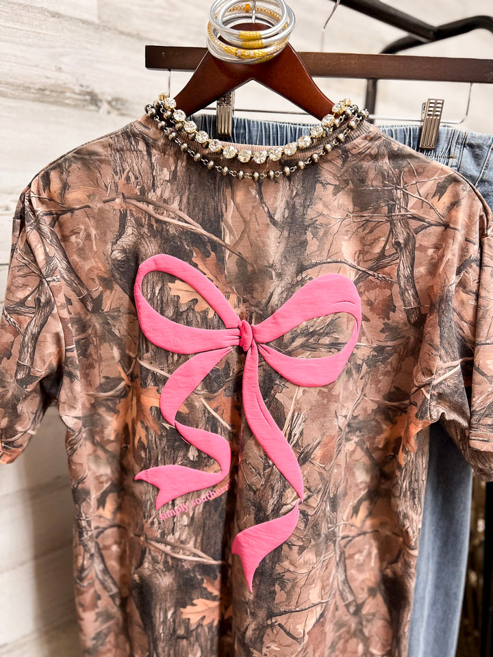 Simply Southern | Southern Belle Front &amp; Back Pink Bow Short Sleeve Graphic T-Shirt in Camouflage