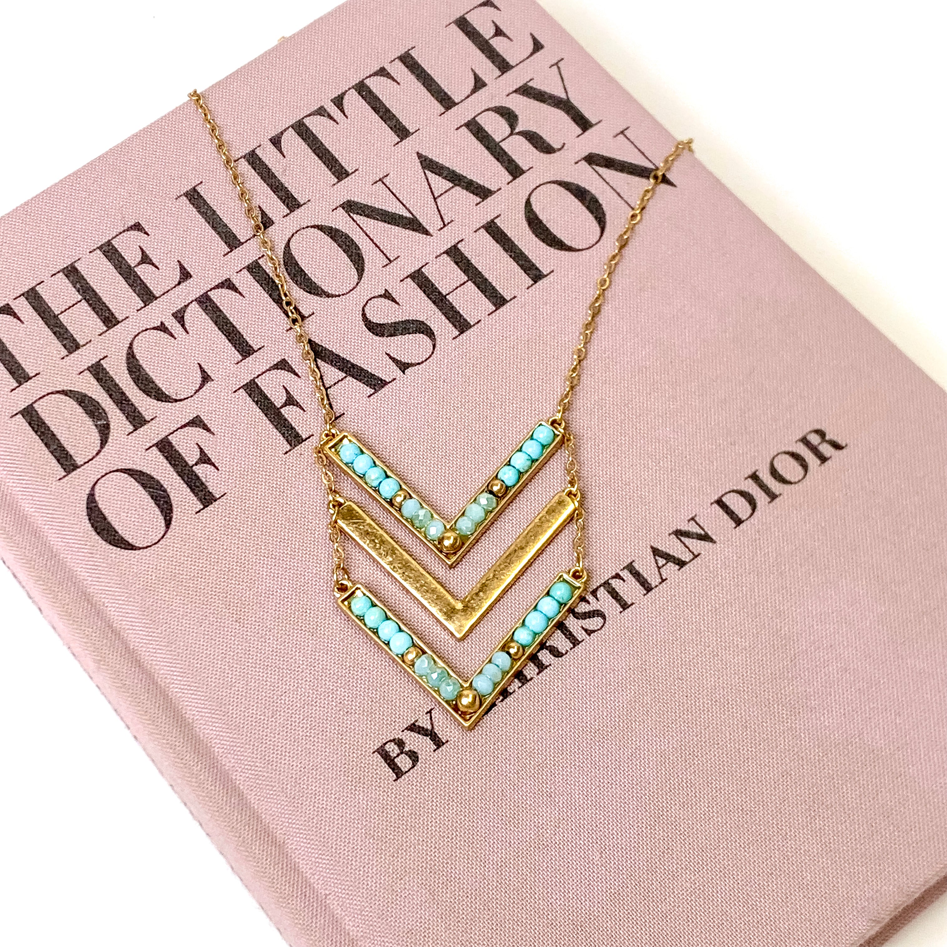 Long Gold Tone Necklace with Faux Turquoise Accented Chevron Pendant - Giddy Up Glamour Boutique