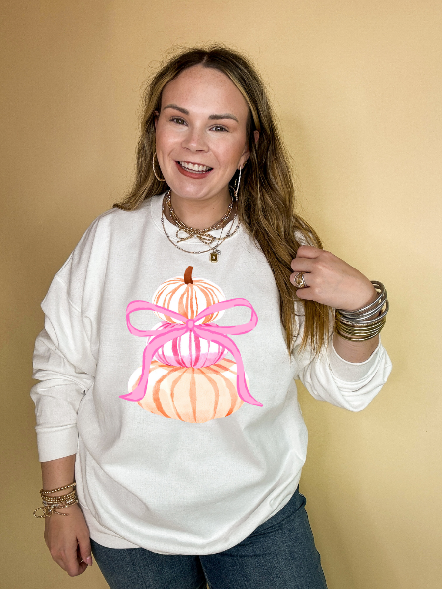 Online Exclusive | Chic Orange and Pink Pile of Pumpkins with Giant Pink Bow Graphic Sweatshirt in Multiple Colors