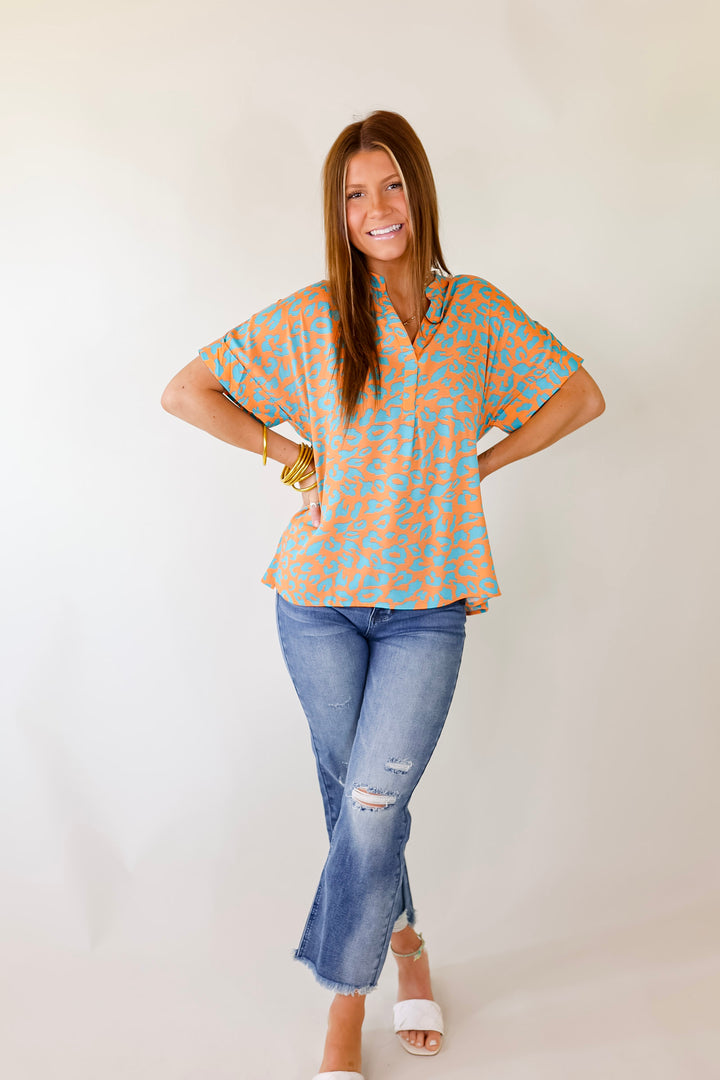 Bold and Beautiful V Neck Teal Leopard Print Top in Orange - Giddy Up Glamour Boutique