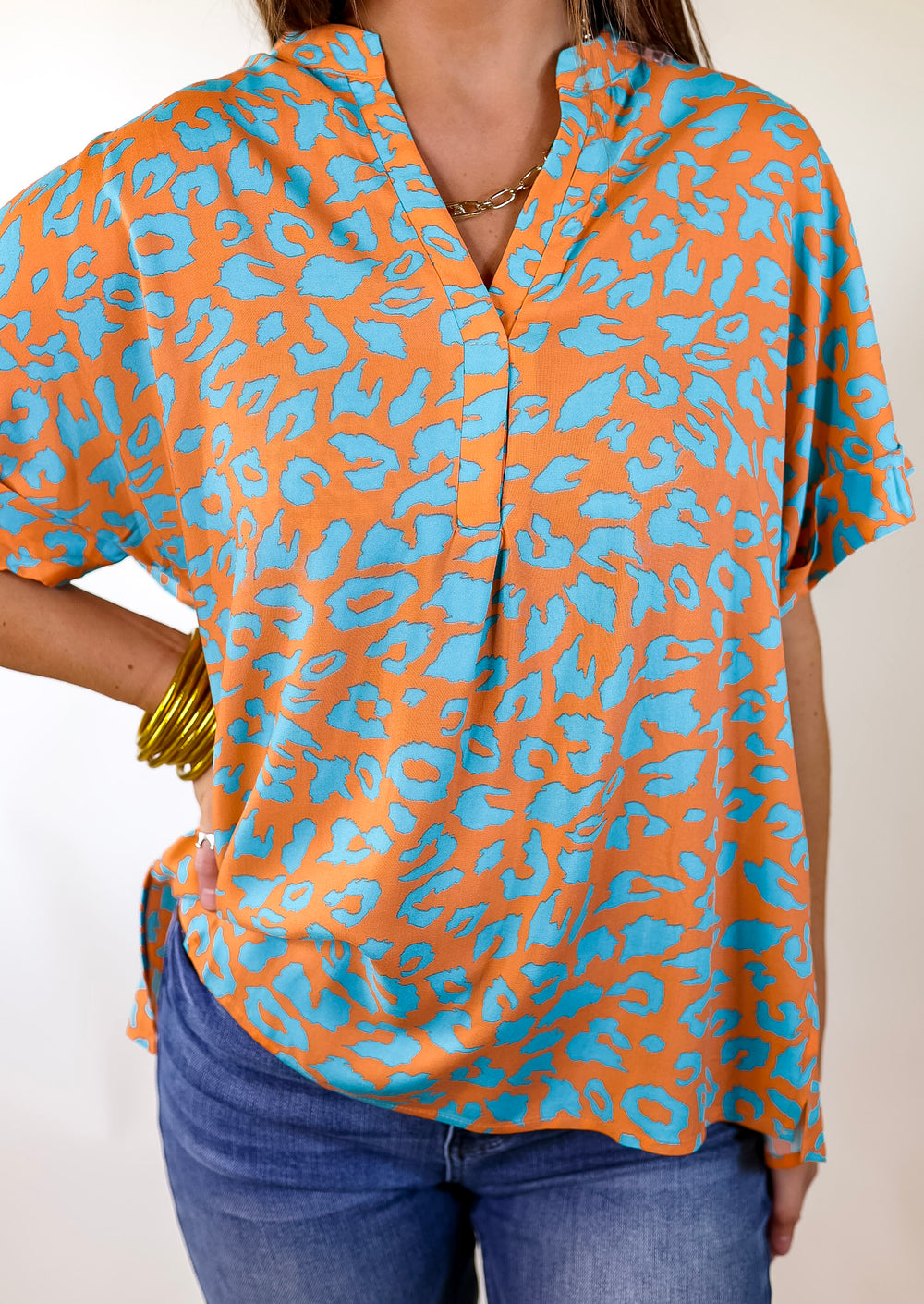 Bold and Beautiful V Neck Teal Leopard Print Top in Orange - Giddy Up Glamour Boutique