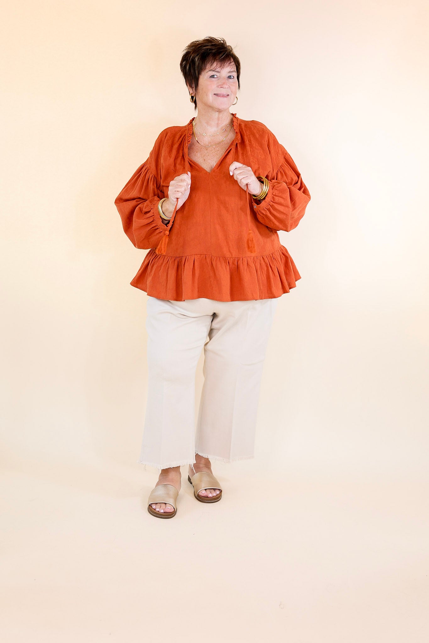 Free Fallin' Textured Long Sleeve Peplum Top with Keyhole Front in Orange