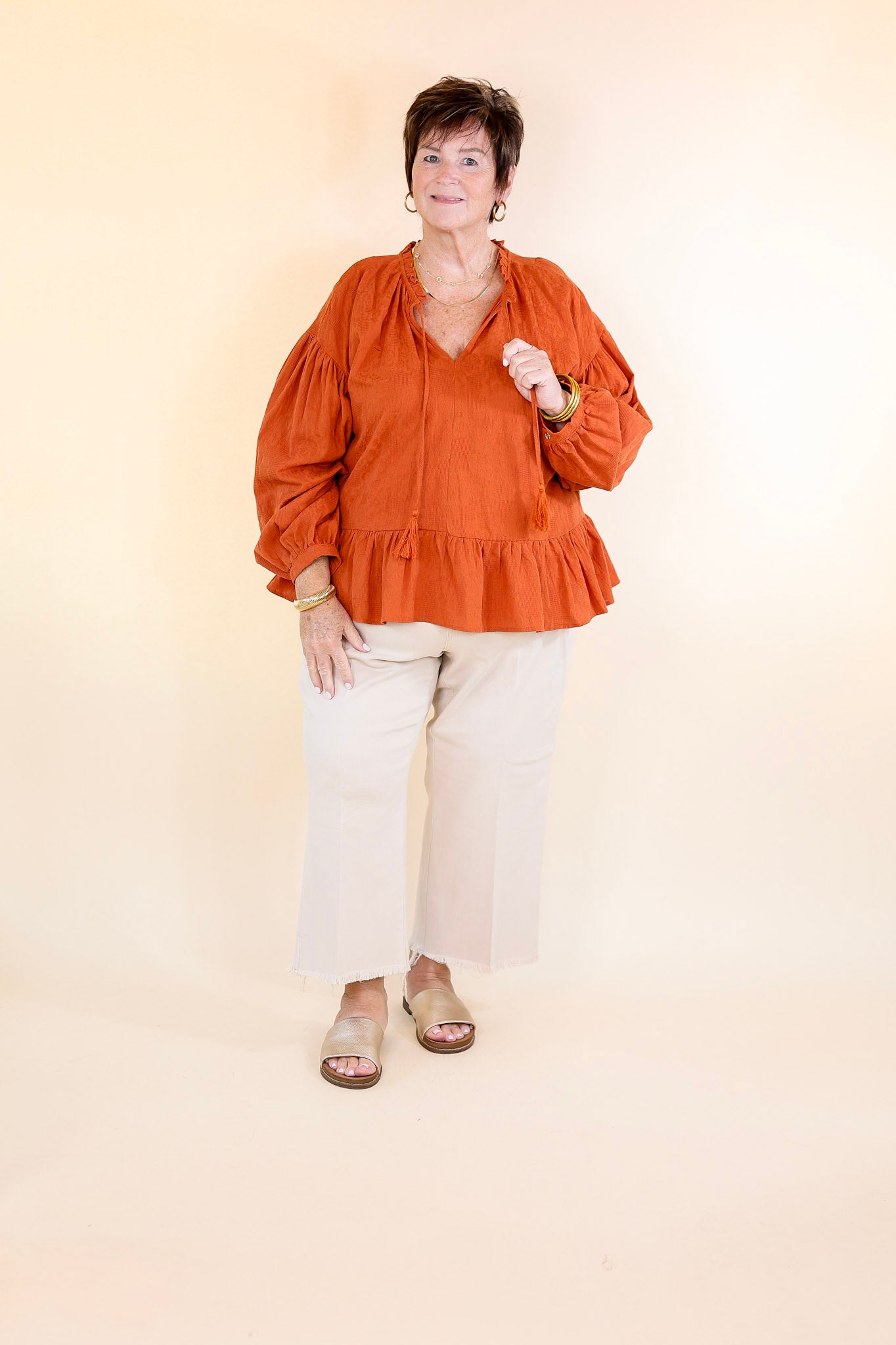 Free Fallin' Textured Long Sleeve Peplum Top with Keyhole Front in Orange