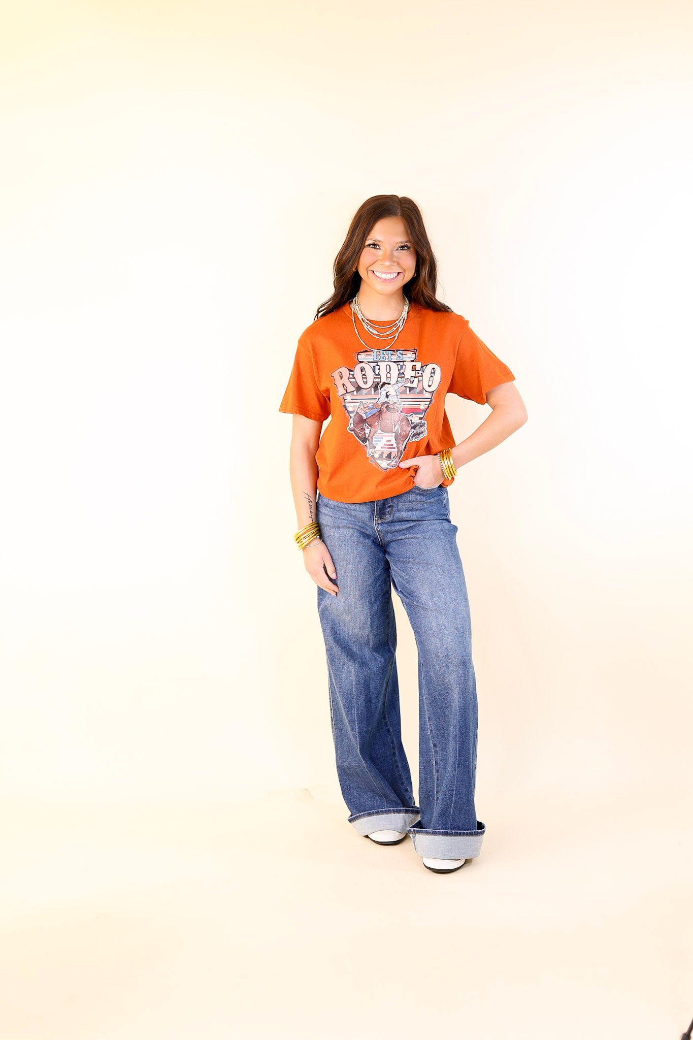 Let's Rodeo Bucking Horse Short Sleeve Graphic Tee in Burnt Orange