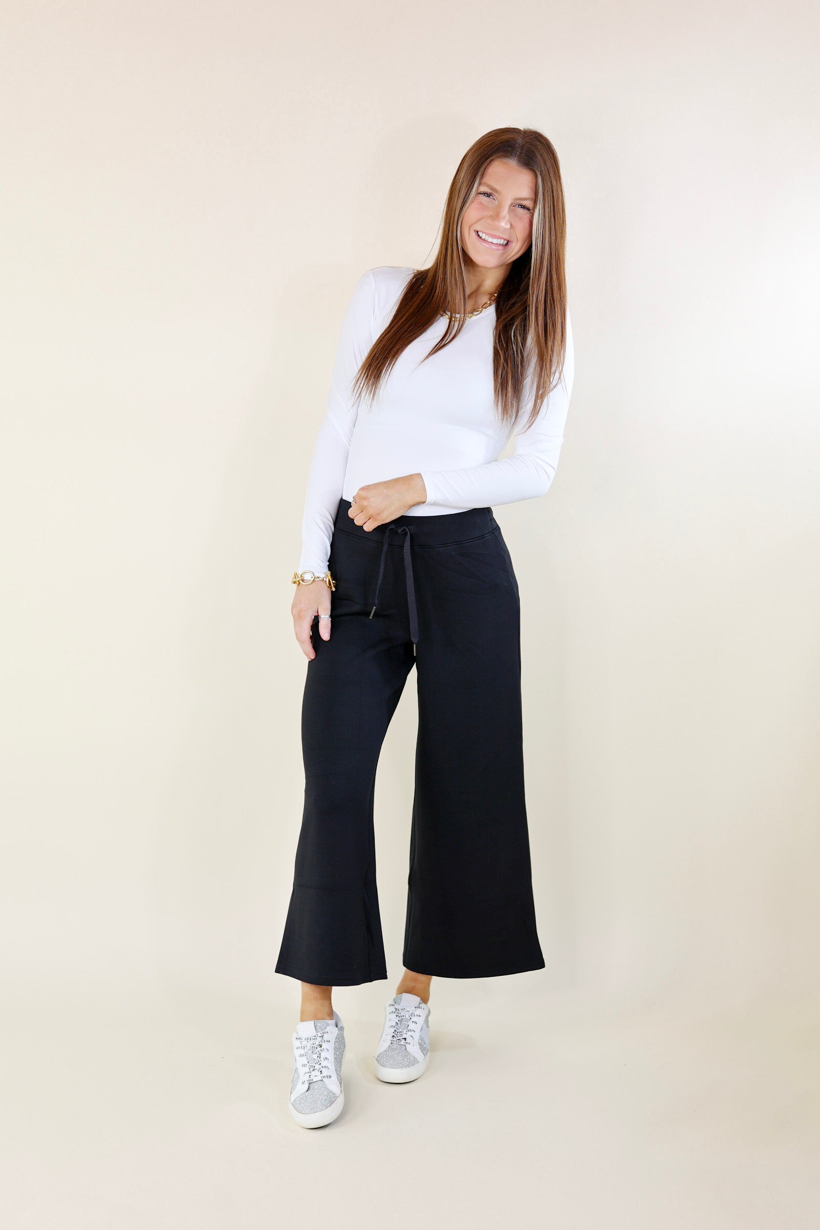 SPANX | AirEssentials Cropped Wide Leg Sweatpants in Black - Giddy Up Glamour Boutique