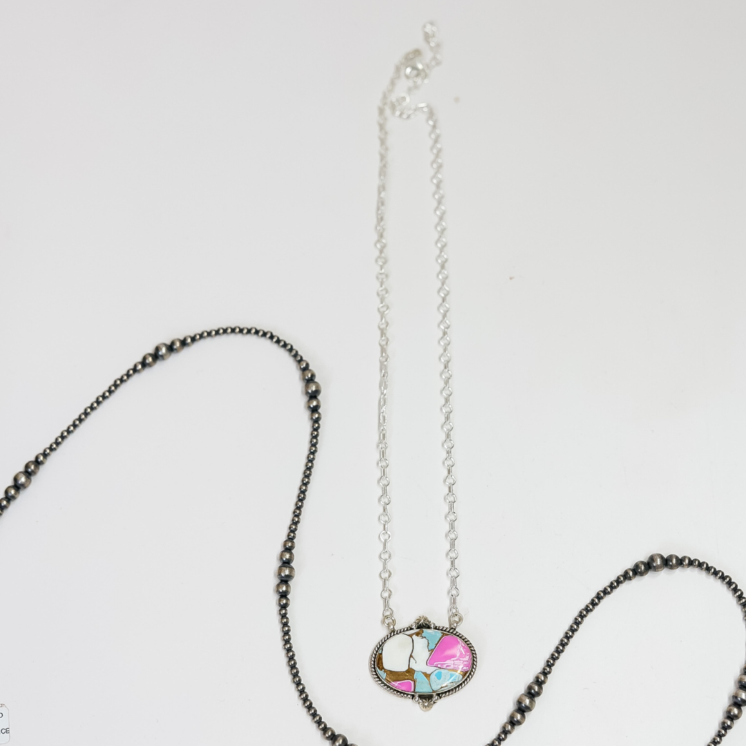 Necklace with a colorful pendant on a white background