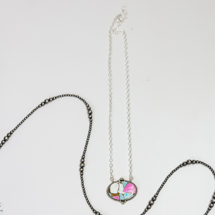 Necklace with a colorful pendant on a white background