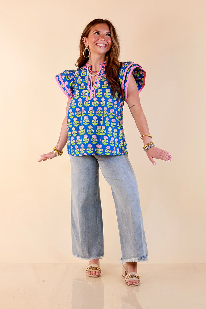 Fresh Perspective V Neck Floral Print Top with Ruffle Cap Flutter Sleeves and Contrast Trim in Royal Blue