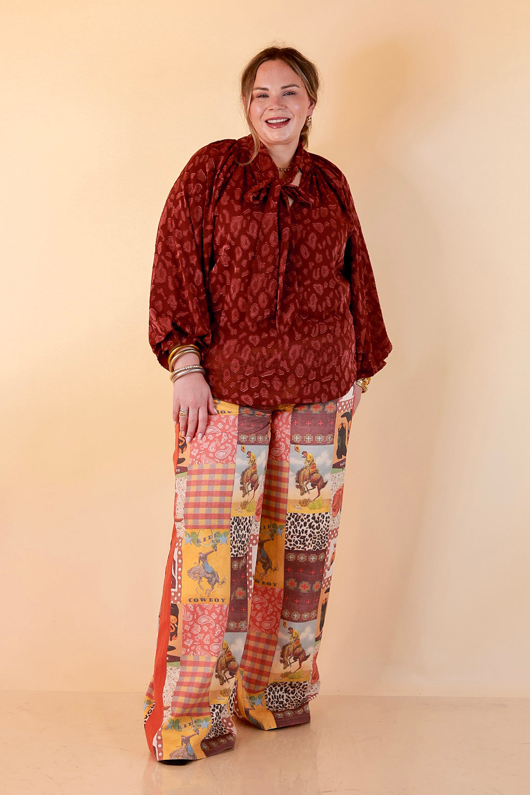Commanding Attention Tie Neck Velvet Animal Print Balloon Sleeve Blouse in Burgundy