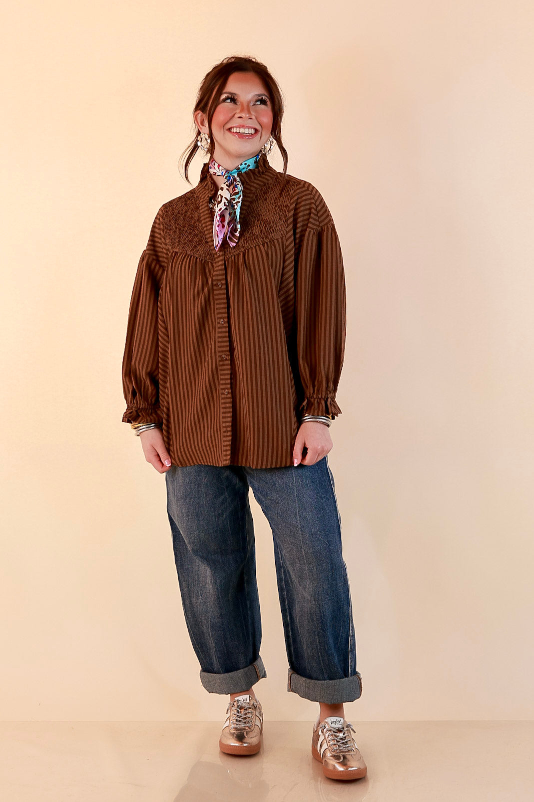 A Fine Line Smocked Ruffle Neck Long Sleeve Striped Button Front Blouse in Chocolate Brown