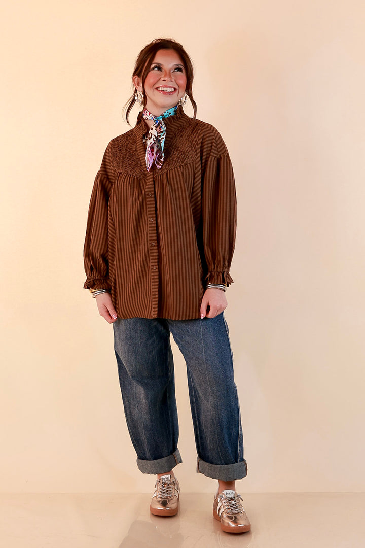 A Fine Line Smocked Ruffle Neck Long Sleeve Striped Button Front Blouse in Chocolate Brown