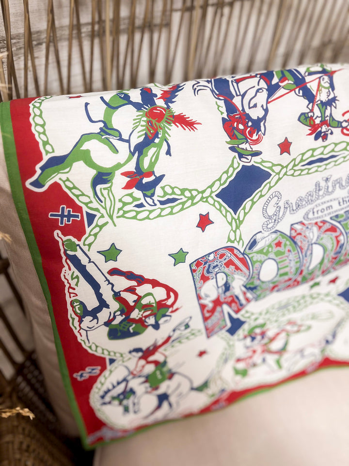 XOXO Art & Co | Greetings from the Rodeo Print Shorty Wild Rag Scarf in Ivory, Green, Red and Blue