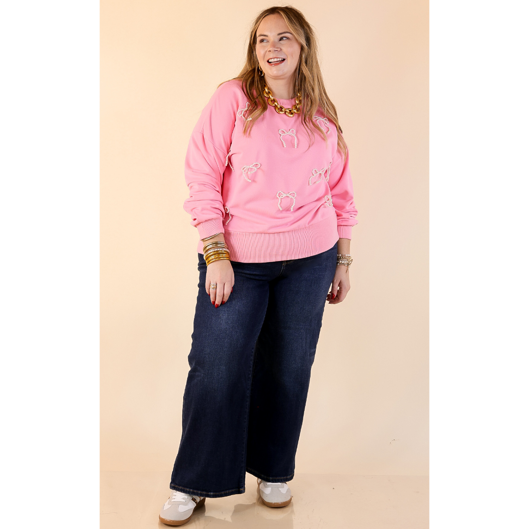 All Tied Up Pearl Bow Detail Long Sleeve Top with Scattered Bow Accents in Pink