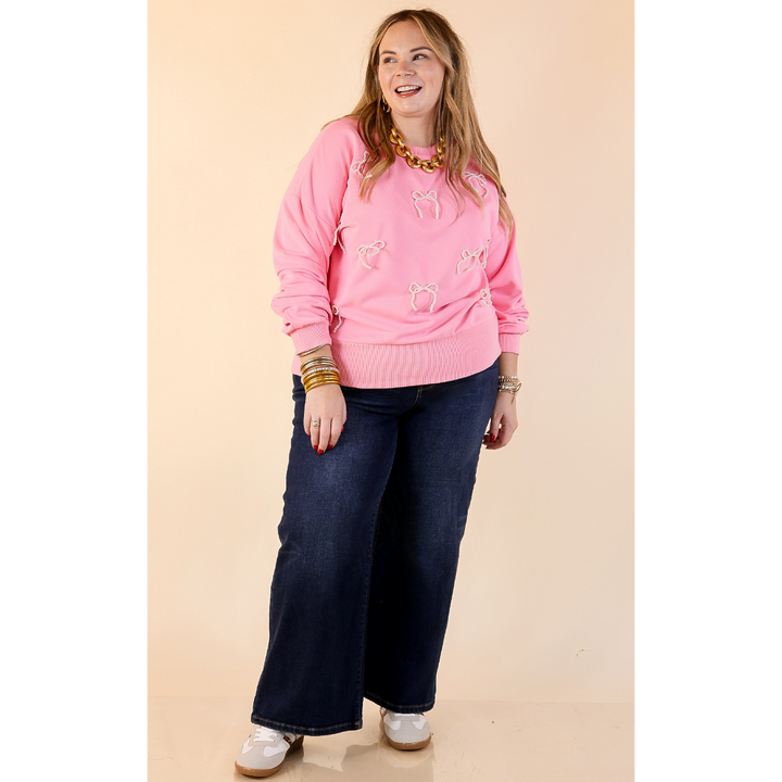 All Tied Up Pearl Bow Detail Long Sleeve Top with Scattered Bow Accents in Pink