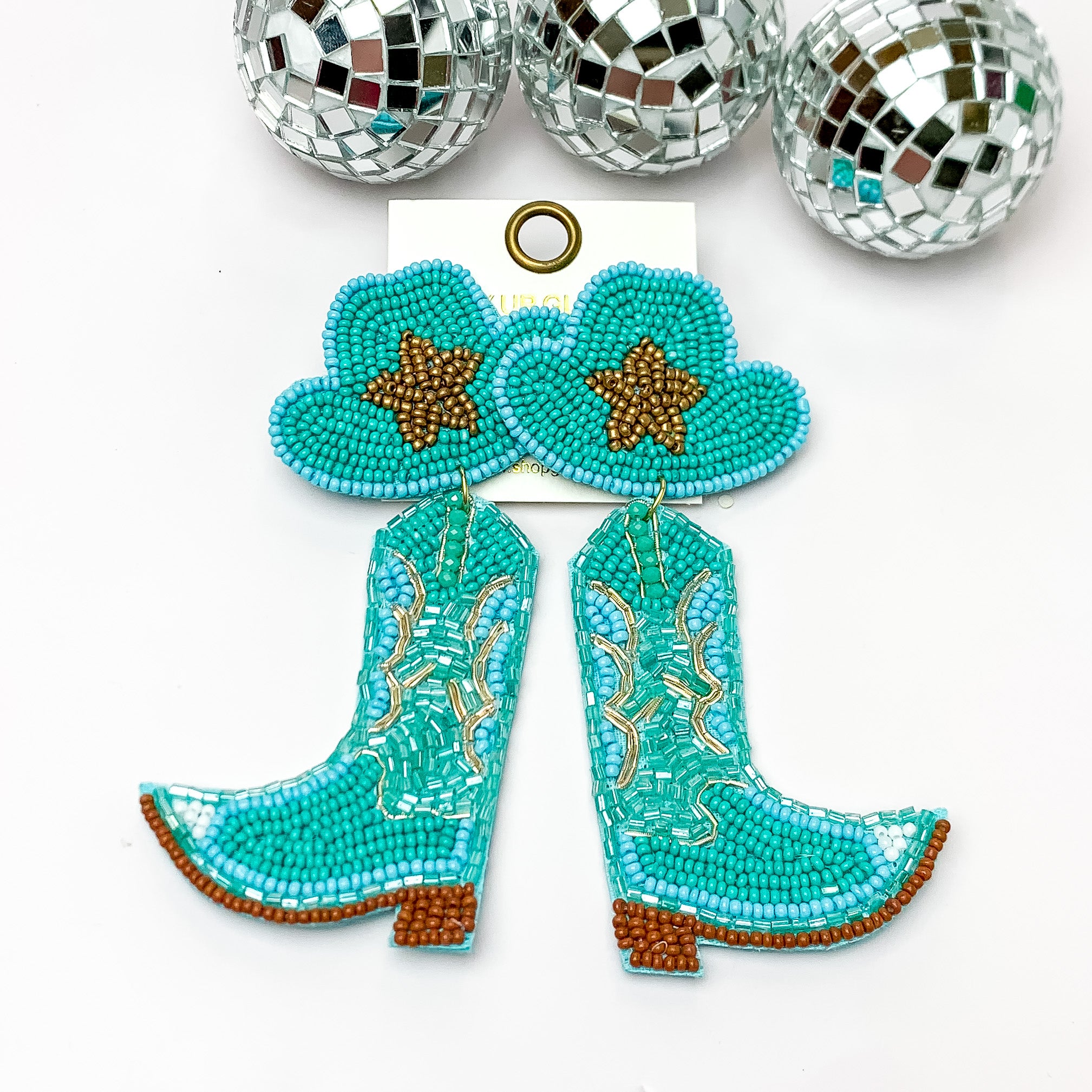 Beaded Blue, and Gold Cowboy Boot Earrings with Hat Studs. Pictured on a white background with disco balls at the top.