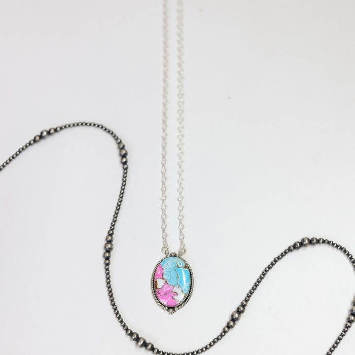 Necklace with a colorful pendant on a white background