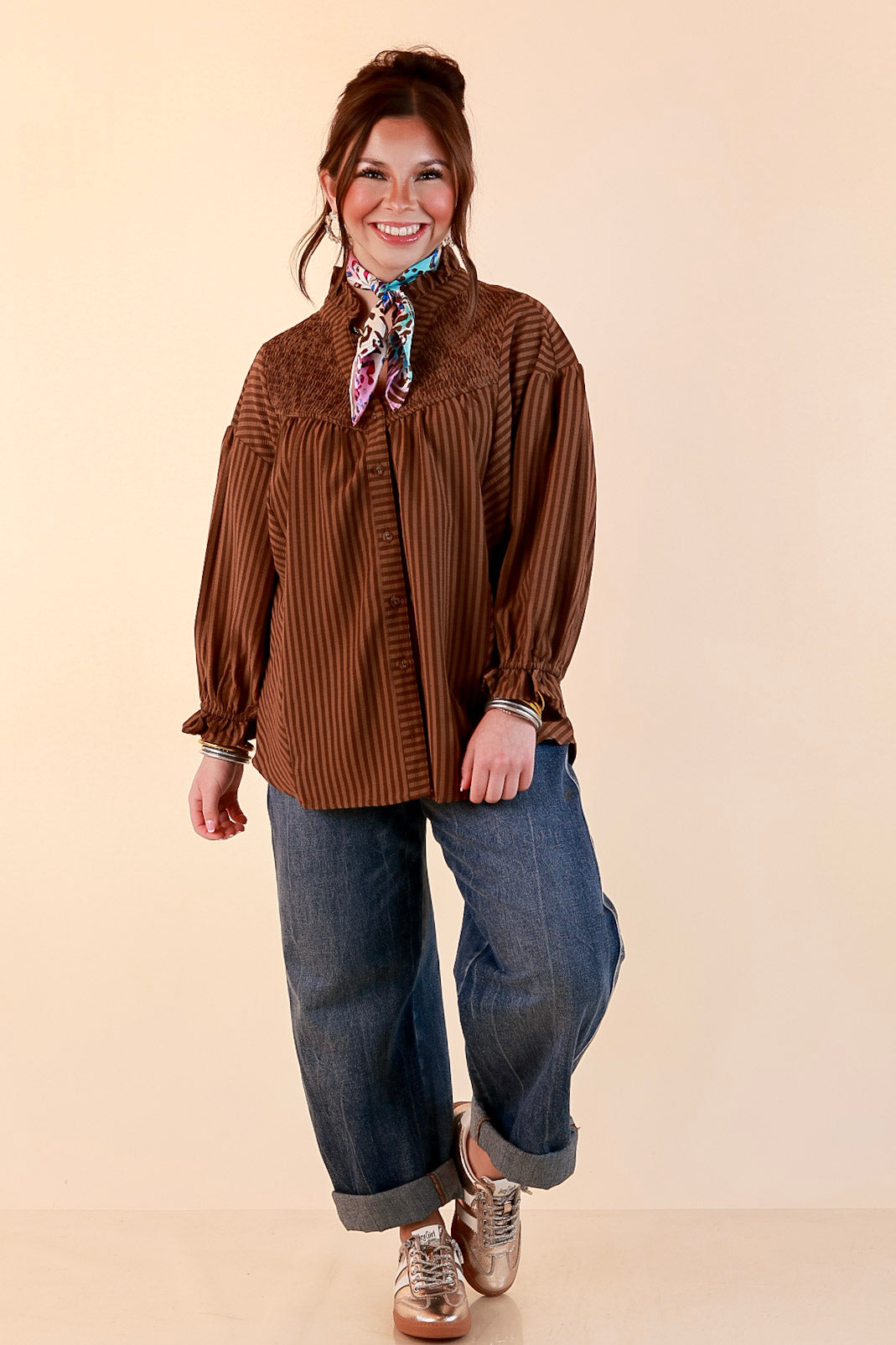 A Fine Line Smocked Ruffle Neck Long Sleeve Striped Button Front Blouse in Chocolate Brown