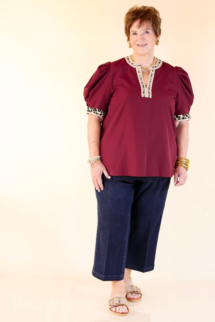 Standout Style V Neck Top with Short Balloon Sleeves and Leopard Print Trim in Maroon