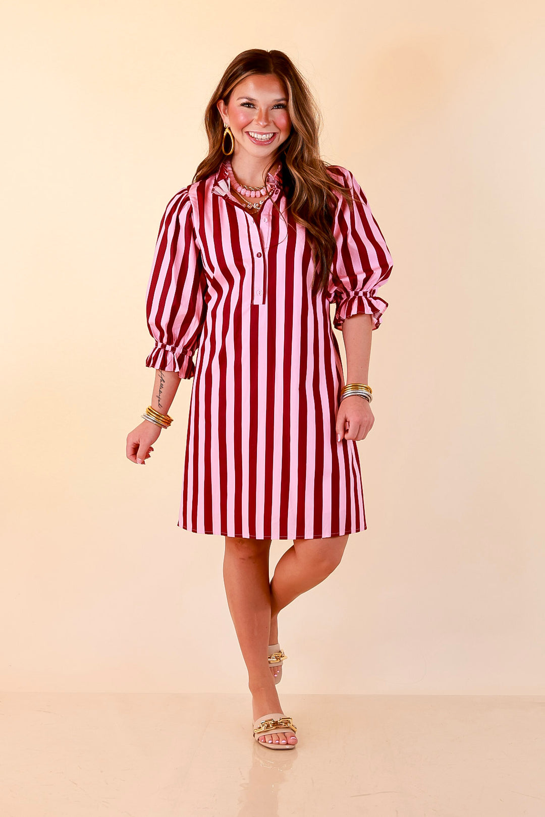 Talk of the Town Striped Ruffle Sleeve Babydoll Dress with Cinched Waist Feature in Maroon and Pink