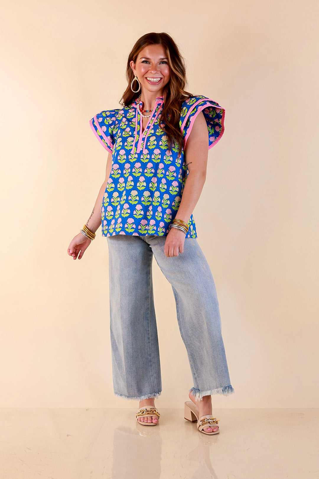 Fresh Perspective V Neck Floral Print Top with Ruffle Cap Flutter Sleeves and Contrast Trim in Royal Blue