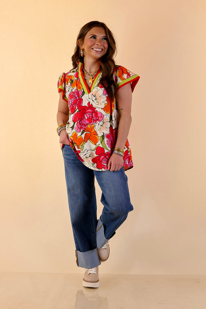 Spring Symphony Floral Print Flutter Sleeve Top with Contrast Trim Split Neckline in Pink and Orange