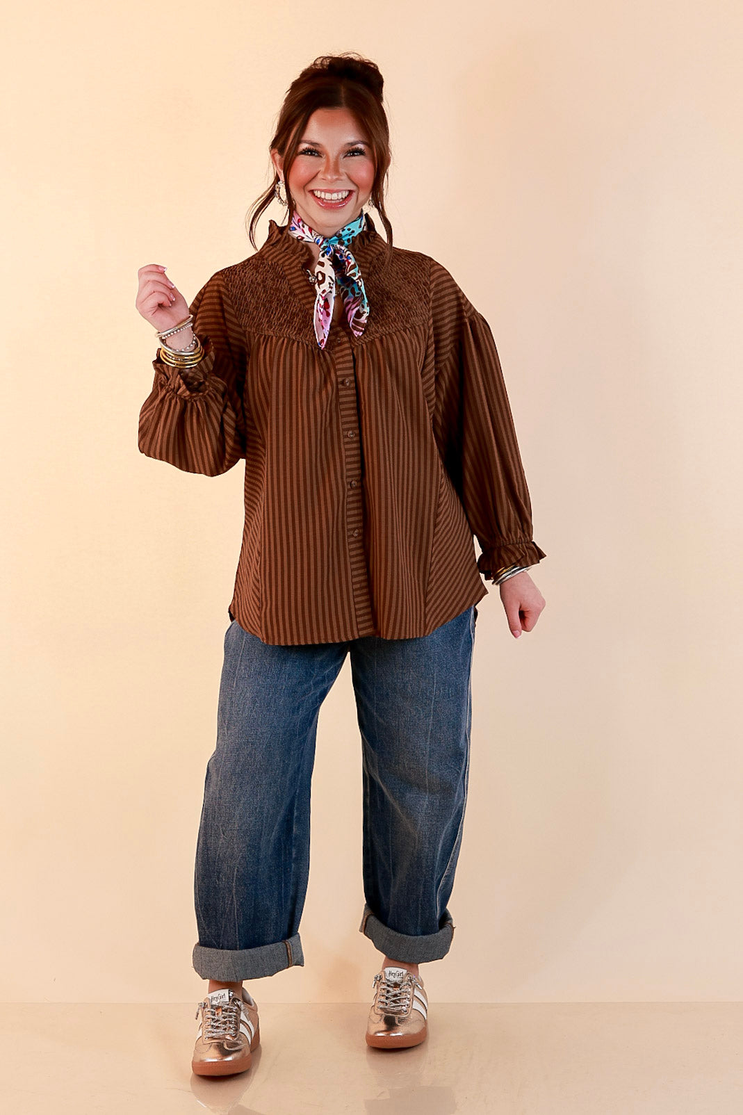 A Fine Line Smocked Ruffle Neck Long Sleeve Striped Button Front Blouse in Chocolate Brown