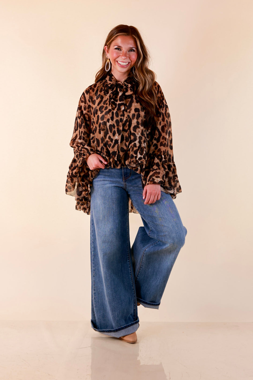 Flirt Factor Long Sleeve Sheer Blouse with Bell Sleeves and Ruffle Detailing and Tie Collar in Leopard Print
