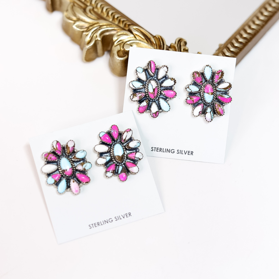 Sterling silver Cotton Candy cluster earrings with pink, blue, and white stones, handcrafted by Native artist HaDa, displayed on jewelry cards.