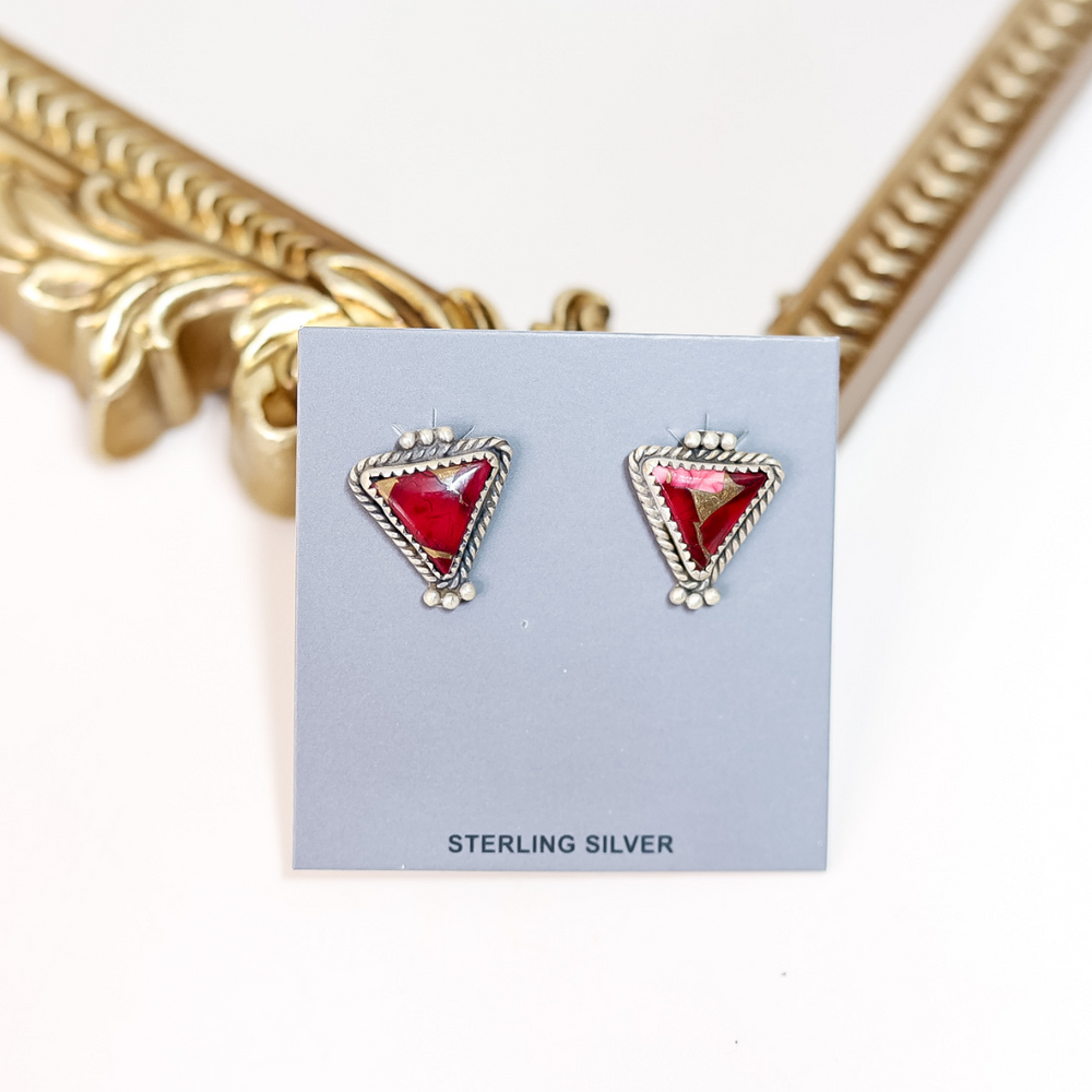 Rose Dahlia handmade triangle earrings on a blue card with 'Sterling Silver' text, gold mirror in background