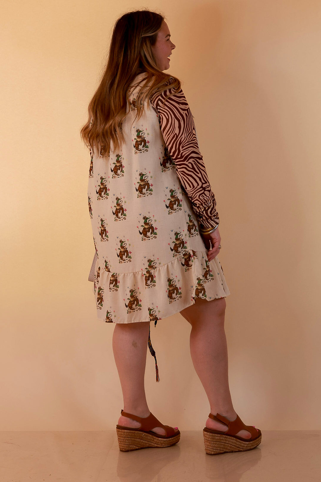 The Showstopper Sleeveless Pearl Snap Bronc Print Ruffle Dress with Sailor Collar and Horseshoe Embroidery in Cream