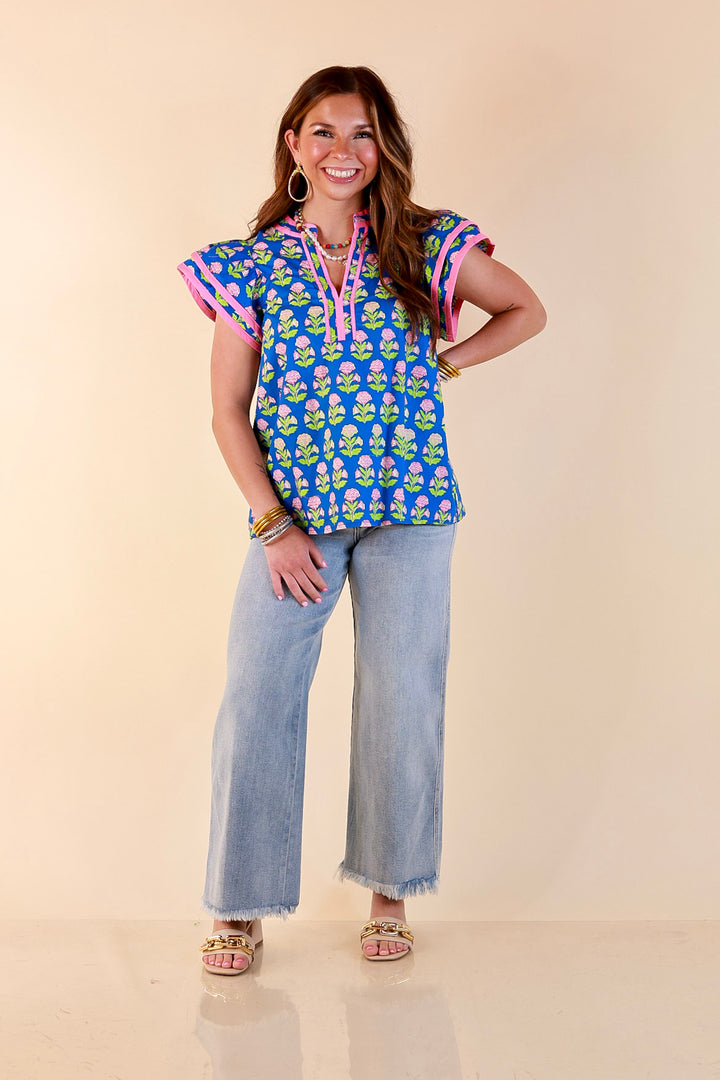 Fresh Perspective V Neck Floral Print Top with Ruffle Cap Flutter Sleeves and Contrast Trim in Royal Blue