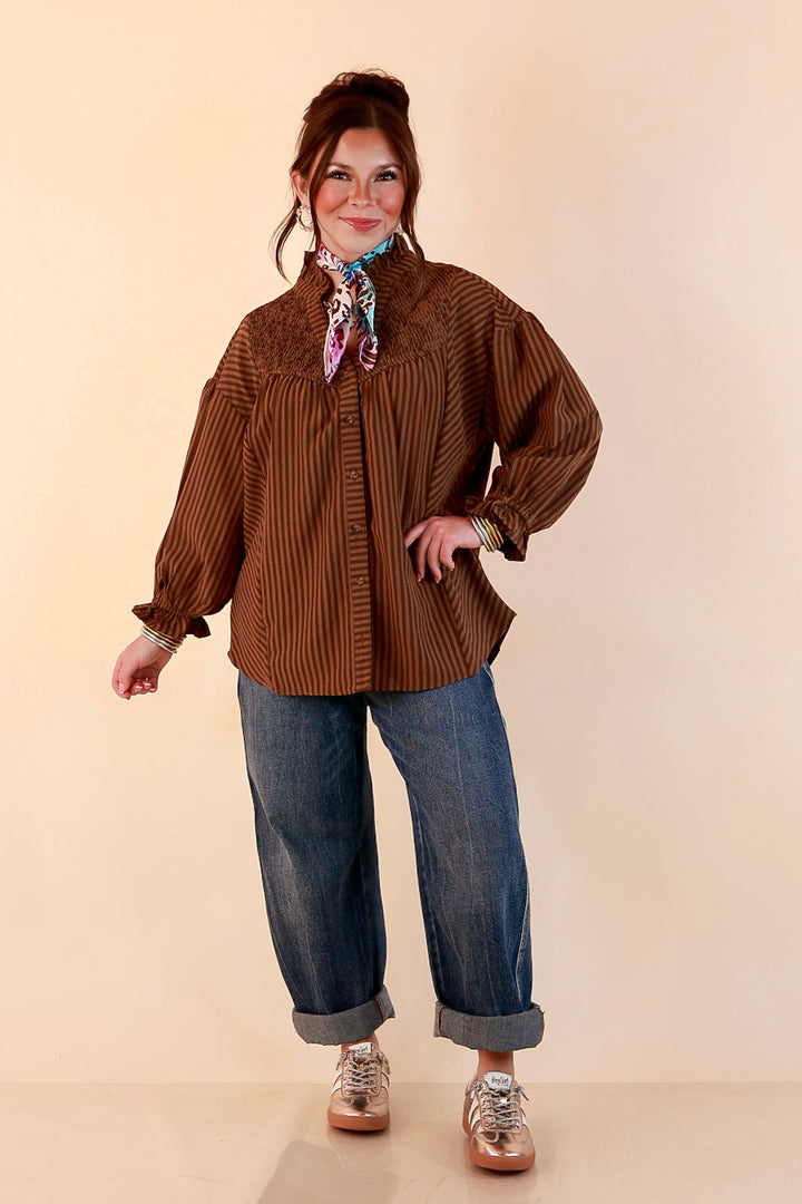 A Fine Line Smocked Ruffle Neck Long Sleeve Striped Button Front Blouse in Chocolate Brown