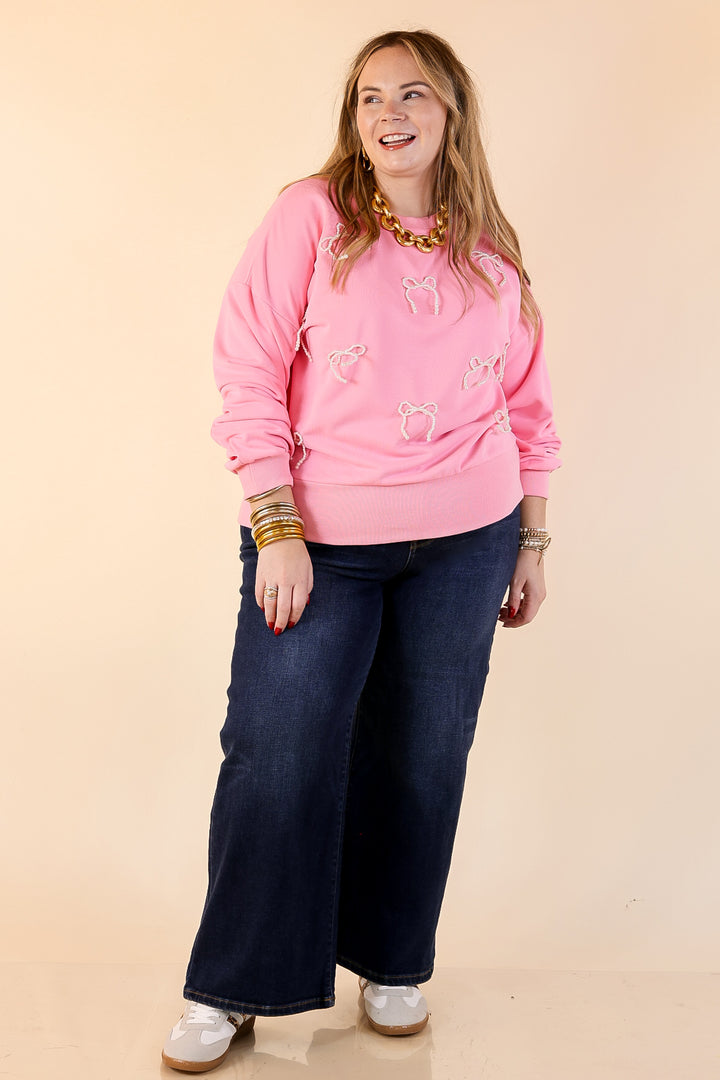 All Tied Up Pearl Bow Detail Long Sleeve Top with Scattered Bow Accents in Pink
