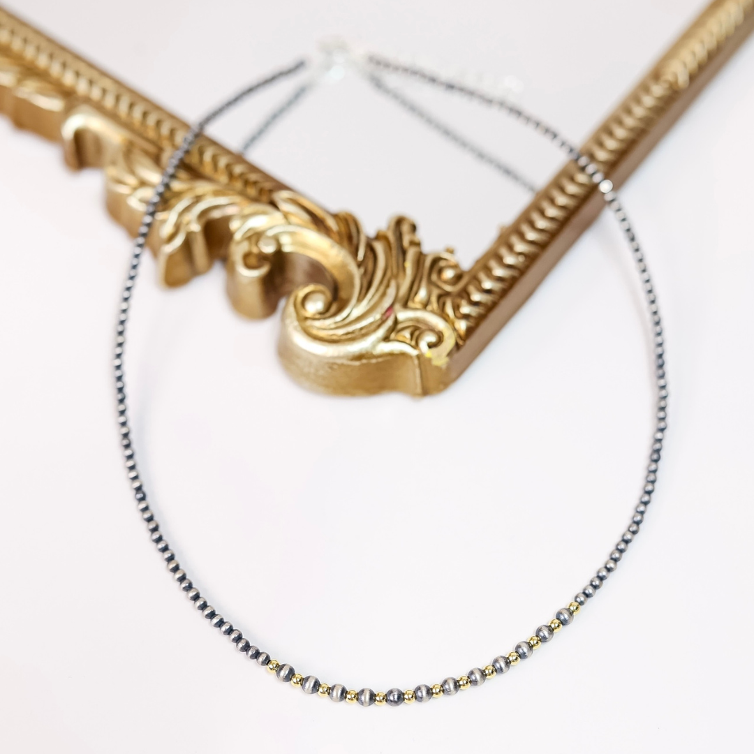 Dainty Navajo pearl necklace with 3mm and 4mm beads and 14K gold-plated center accents, 18-inch length with 2-inch extender chain.