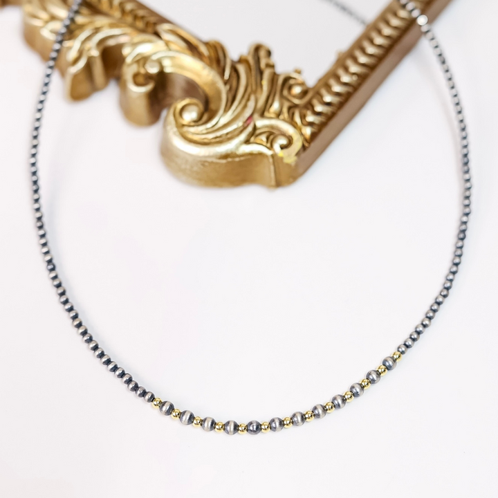 Dainty Navajo pearl necklace with 3mm and 4mm beads and 14K gold-plated center accents, 18-inch length with 2-inch extender chain.