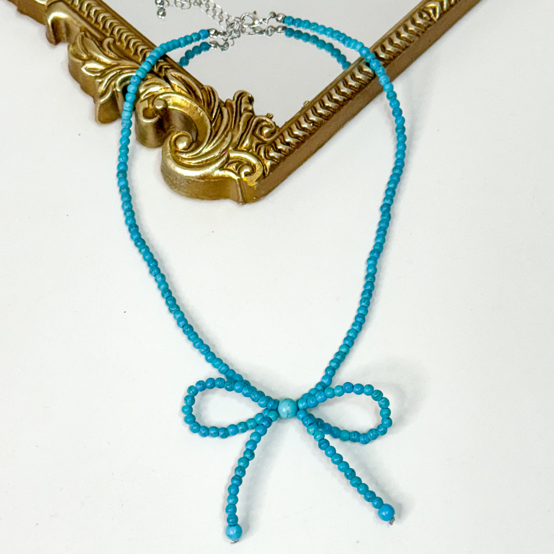 Faux Turquoise Bow Necklace 🎀 western cowgirl jewelry, 16-inch turquoise beaded necklace with bow design and 3-inch adjustable chain.