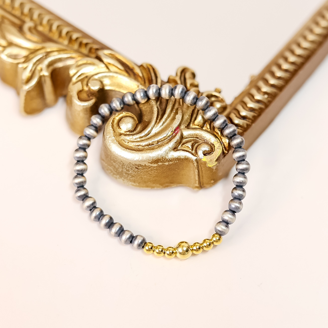 Stretch bracelet with 5mm sterling silver Navajo pearls and 14K gold-filled beads, handmade and designed for layering.