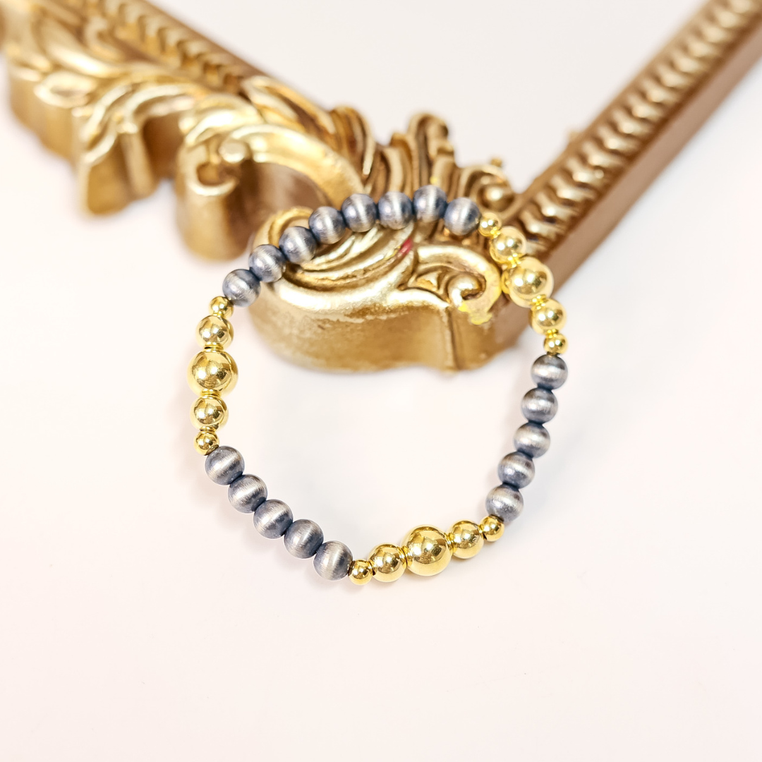 Stretch bracelet with 6mm sterling silver Navajo pearls and 14K gold-filled beads, handmade and designed for easy everyday wear.