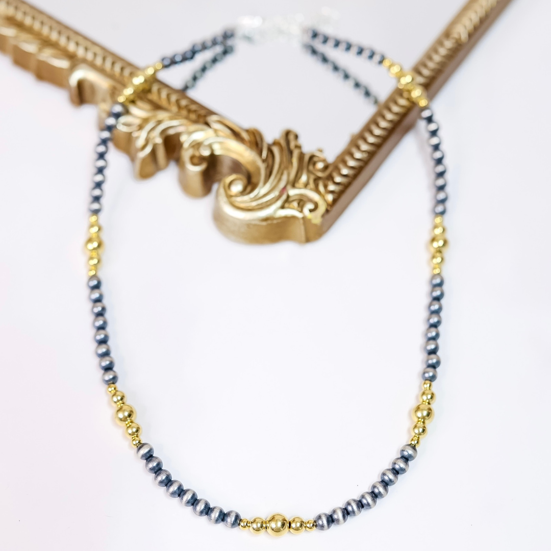 Hand-strung Navajo pearl and 14K gold-plated bead necklace with 6mm silver pearls and mixed gold accents, 20 inches long with adjustable 2-inch extender.