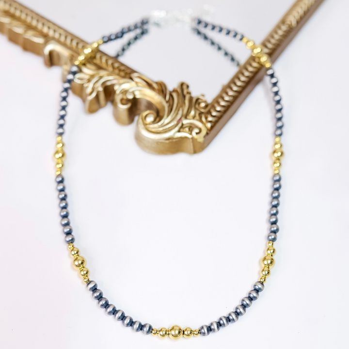 Hand-strung Navajo pearl and 14K gold-plated bead necklace with 6mm silver pearls and mixed gold accents, 20 inches long with adjustable 2-inch extender.