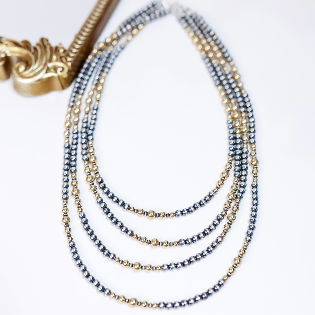 Layered Navajo pearl necklace with 5mm sterling silver beads and 14K gold accents, available in 18, 20, 22, and 24 inch lengths.