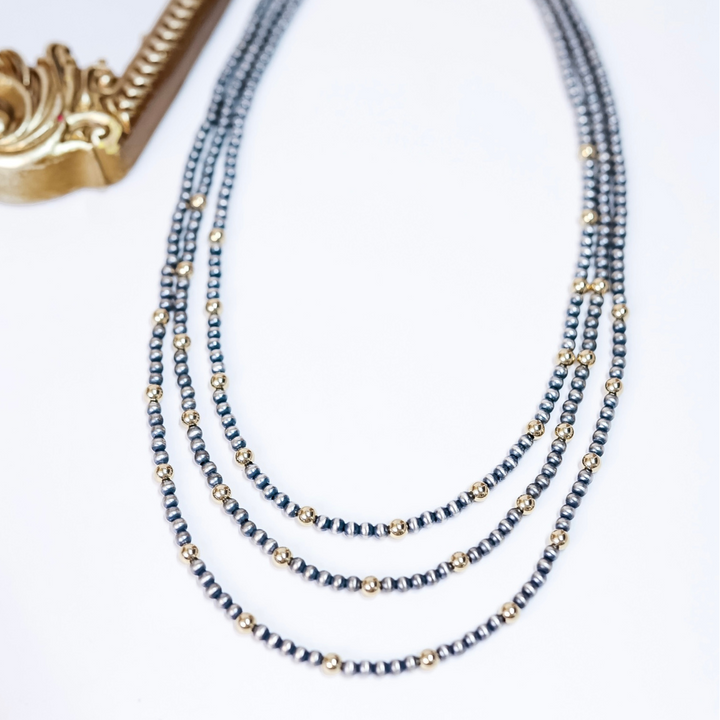 Dainty Navajo pearl and gold bead necklace with 4mm sterling silver pearls and 5mm gold accents, available in 20, 22, and 24 inch lengths.