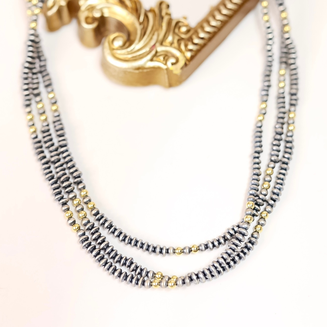 Hand-strung necklace with 5mm saucer Navajo pearls and 14K gold-plated beads, 20-inch length with adjustable 2-inch extender.