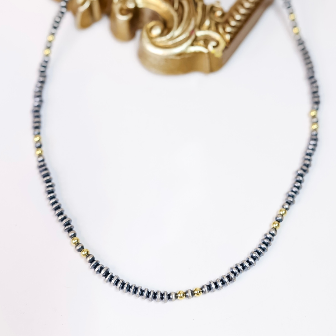 Hand-strung necklace with 5mm saucer Navajo pearls and 14K gold-plated beads, 20-inch length with adjustable 2-inch extender.