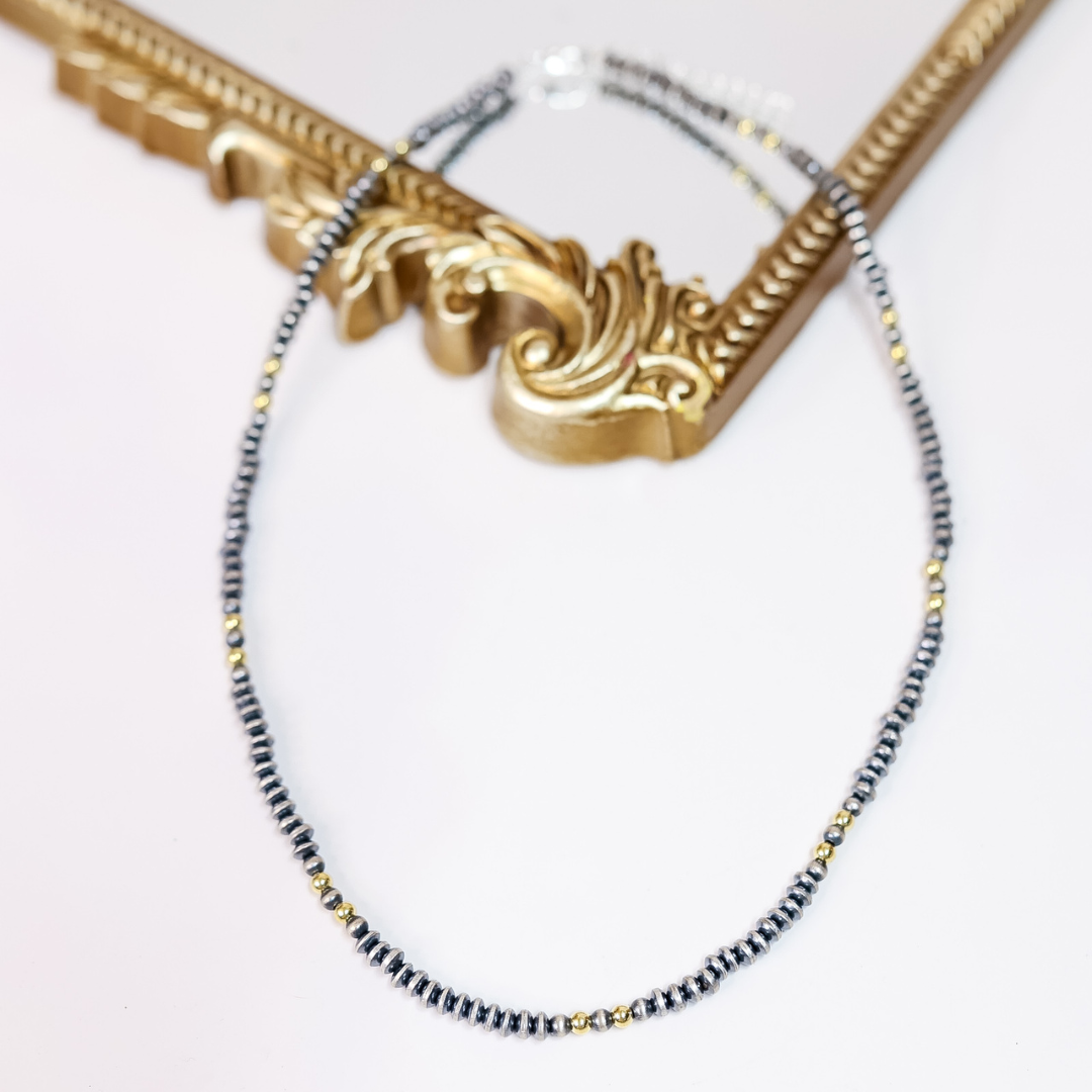 Hand-strung necklace with 5mm saucer Navajo pearls and 14K gold-plated beads, 20-inch length with adjustable 2-inch extender.