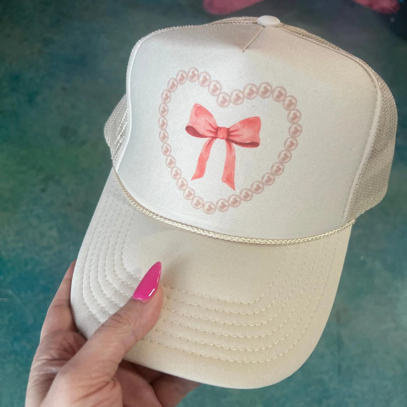 Online Exclusive | Pearl Heart Bow Coquette Foam Trucker Cap in Solid Cream - Giddy Up Glamour Boutique