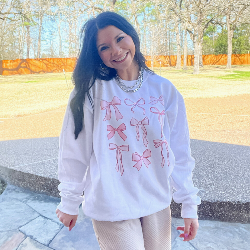 Online Exclusive | Coquette Bow Collection Long Sleeve Graphic Sweatshirt in White - Giddy Up Glamour Boutique